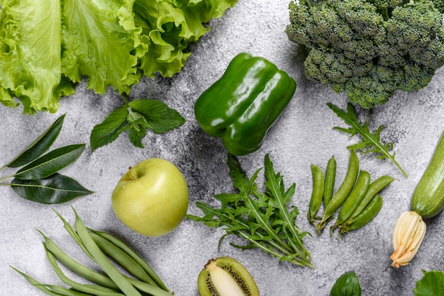 Photo composition of bright and juicy green vegetables, spices and herbs