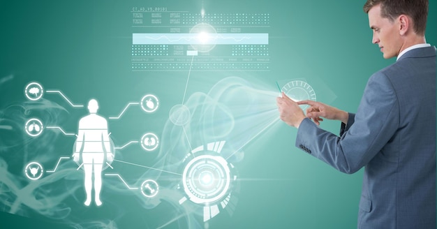 Composition of businessman holding interactive screen with medical data processing