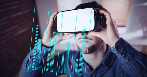 Photo composition of businessman wearing vr headset and data processing on digital screen