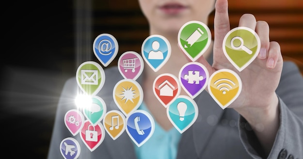 Composition of businesswoman touching screen with digital colourful icons