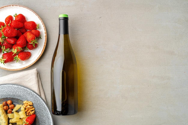 Composition of cheese, and fruits on gray table