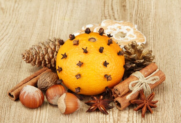 Composition of christmas spices, on wooden background