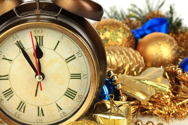 Composition of clock and christmas decorations close-up