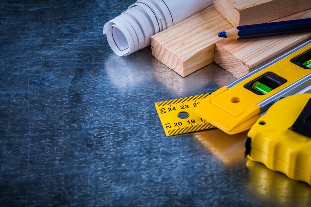 Composition of construction working tools on metallic scratched background architecture and building concept