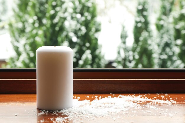 Composition of cozy winter day on wooden windowsill