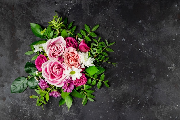 Composition of delicate summer flowers on black