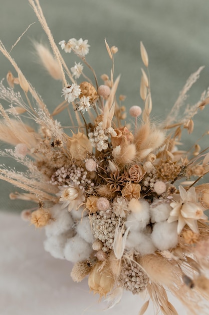 Composition of dried flowers in beige shades