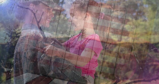 Composition of female soldier embracing smiling daughter over american flag