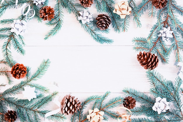 Composition of fir branches decorated with cones and bows