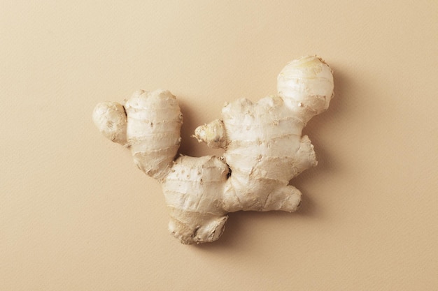 Composition of fresh ginger root on the background.