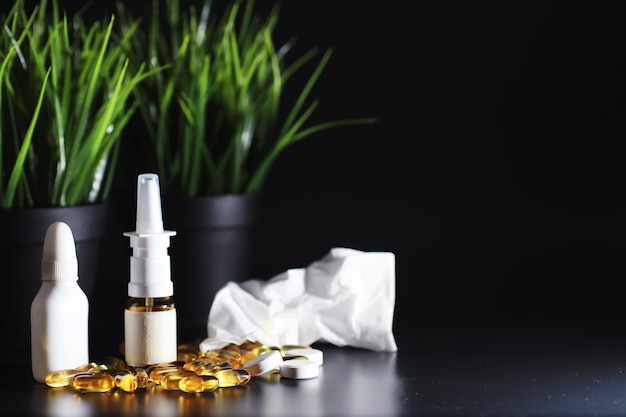 Composition from Bottles of cough syrup.Healthcare, medicine, flu and treatment concept - paper wipes and thermometer with pills.