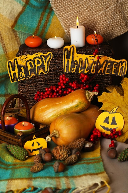 Composition for halloween with pumpkins on fabric background