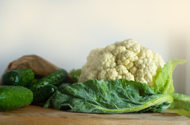 Composition of large cauliflower and young cucumbers