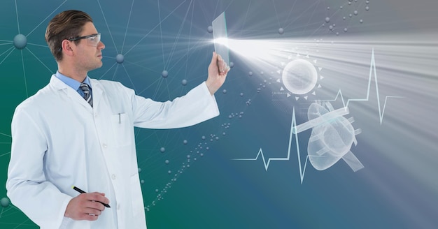 Photo composition of male doctor holding interactive screen with medical data processing