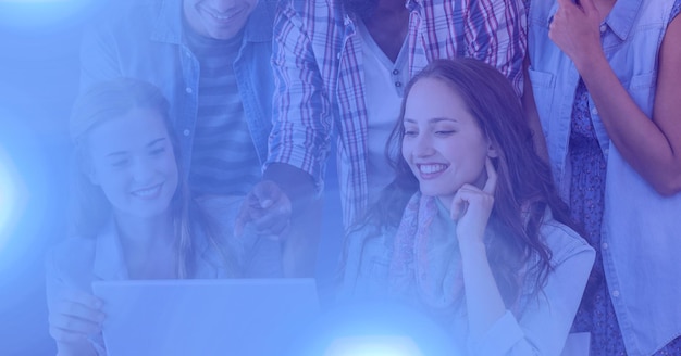 Photo composition of male and female students using laptop with blue glow