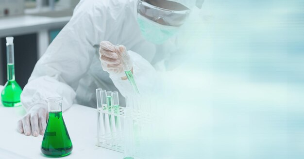 Composition of male scientists in lab using pipette and test tubes with motion blur