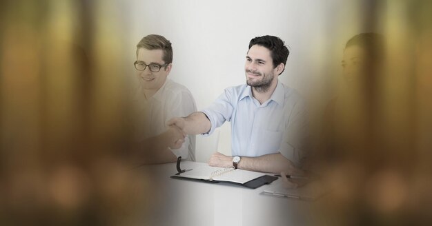 Composition of man shaking hands in office at job interview