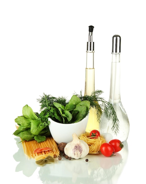 Composition of mortar pasta and green herbals isolated on white