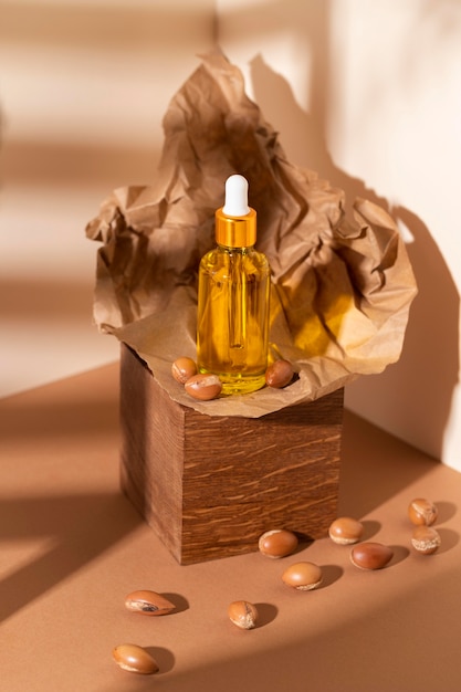 Photo composition of natural argan oil dropper