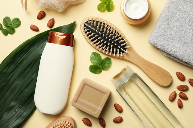 Composition of personal hygiene with bottles of cosmetics on beige background