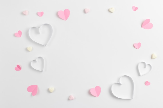 Composition of pink hearts made of paper