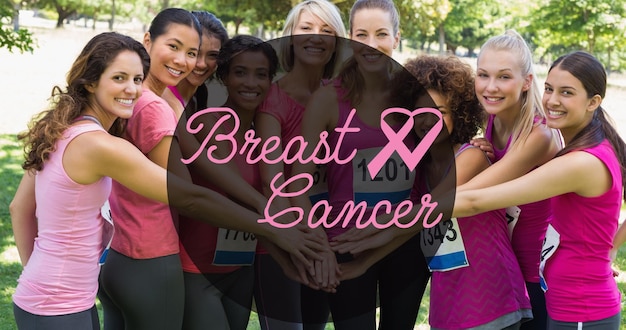 Photo composition of pink ribbon logo and breast cancer text over diverse group of smiling women