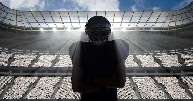 Composition of portrait of american football player on sports stadium