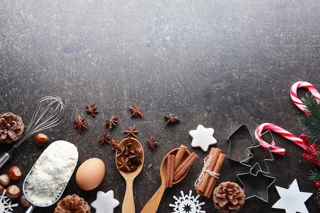 Composition of products and Christmas decor on dark table