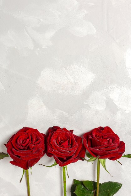 Composition of red roses and gift boxes