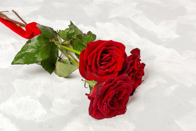 Composition of red roses and gift boxes