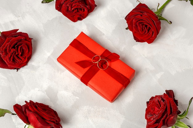 Composition of red roses and gift boxes