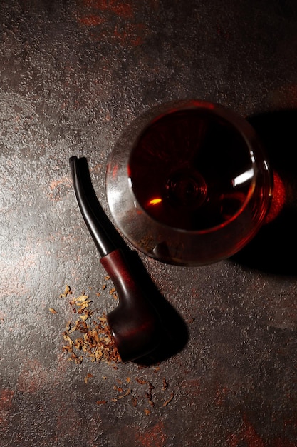 Composition of relaxation with smoking pipe and whiskey