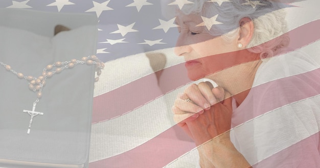 Photo composition of rosary bible and woman praying over american flag