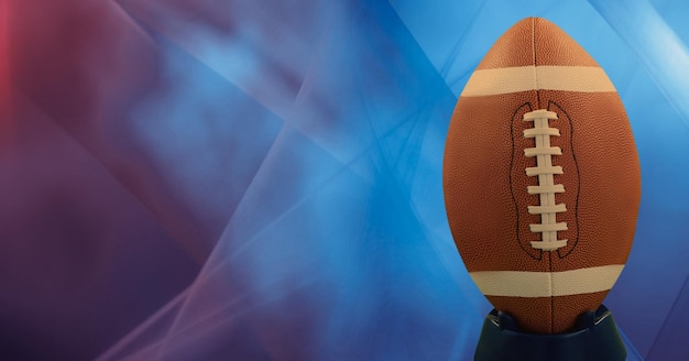 Composition of rugby ball with copy space with spots of light on blue background