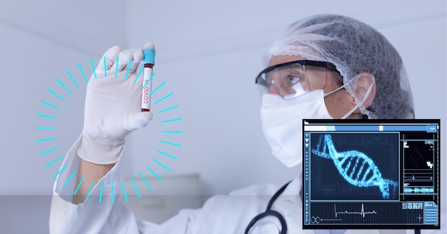 Photo composition of scope, screen with dna over doctor in ppe suit holding covid 19 test tube