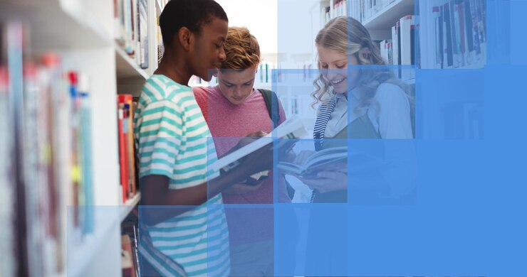 Photo composition of smiling school children reading in library, with blue block copy space on right