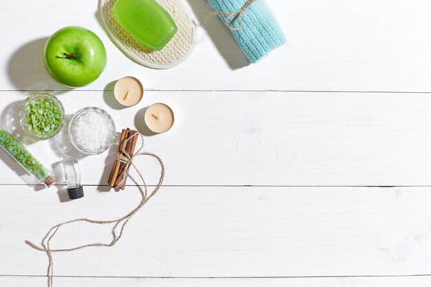 Composition of spa treatment on white wooden table with space for text top view