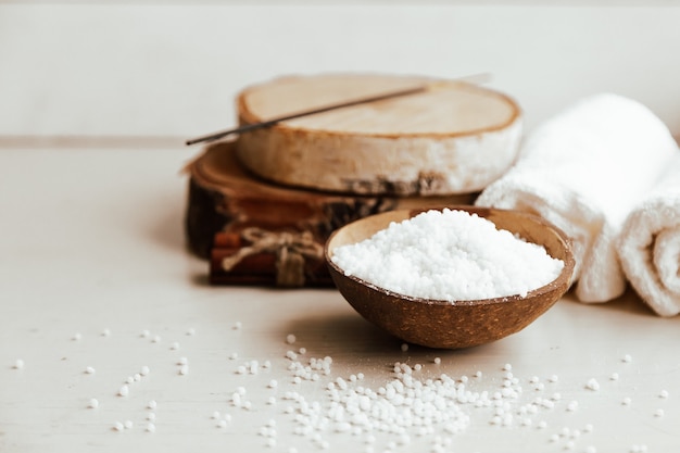 Composition of spa treatment on the white wooden table.