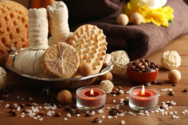 Composition of spa treatment on wooden table on dark color background