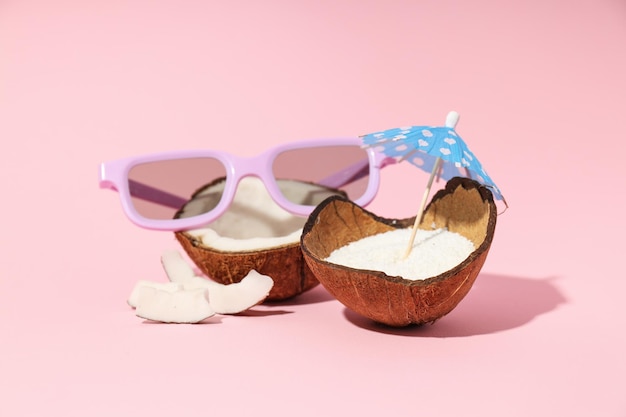 Composition for summer concept with coconut on pink background