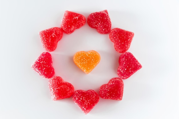 Composition of sweet red fruit jelly in the shape of a heart