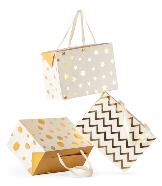 Composition of three falling gift paper boxes isolated on white background.