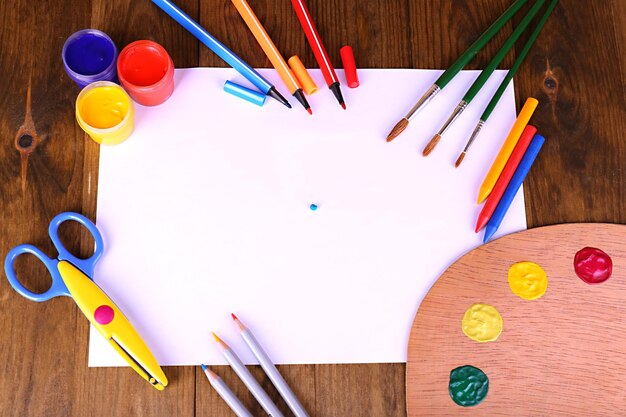 Photo composition of various creative tools on table closeup