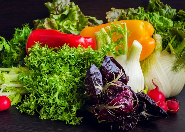 Composition with assorted raw organic vegetables.