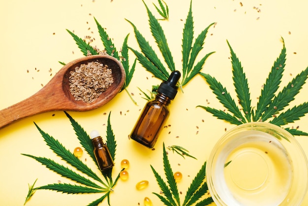 Composition with bottle of CBD oil or serum hemp leaves and seeds Balm and relaxing oil for healing Hemp products The concept of creating natural cosmetics