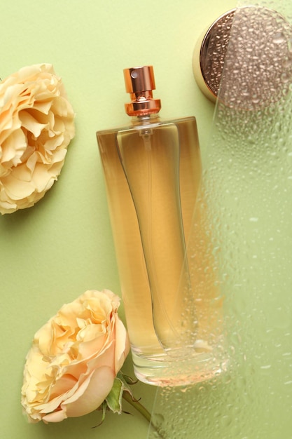 Composition with bottle of female perfume, close up