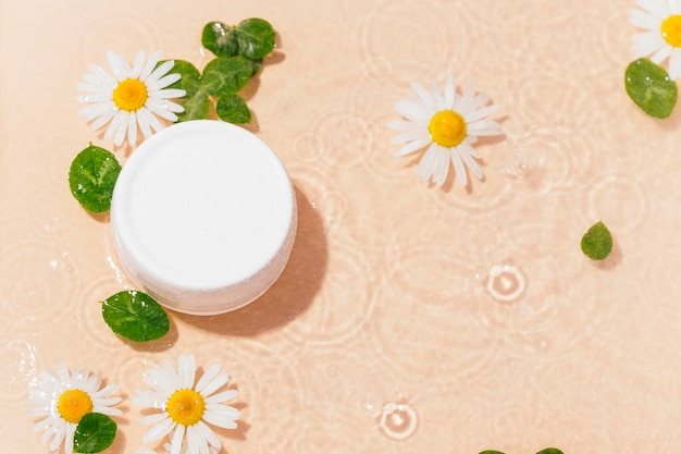 Composition with bottles of natural cosmetic serum on light background, top view