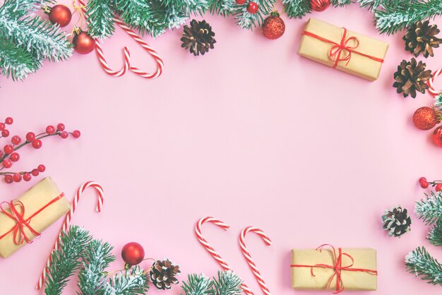 Composition with Christmas decoration on pink background for greeting card