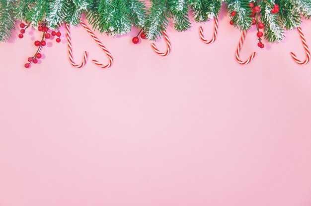 Composition with Christmas decoration on pink background for greeting card