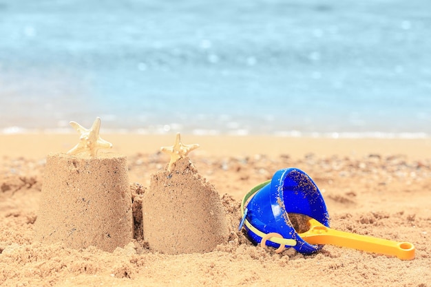 Composition with colorful toys on sea shore Vacation concept